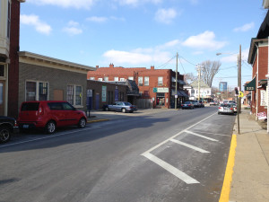 Businesses along High street; note parking takes the place of sidewalk.