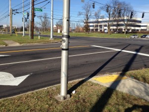 Sidewalk crossing Squires behind the stop line